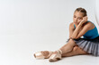 © SHOTPRIME STUDIO - woman ballerina sitting on the floor exercise performing gymnastics