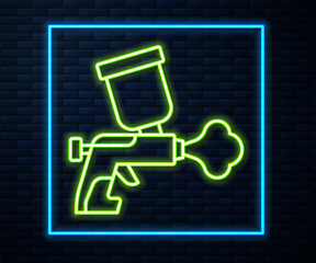 Poster - Glowing neon line Paint spray gun icon isolated on brick wall background. Vector