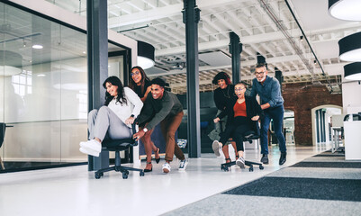 Wall Mural - Team of businesspeople having fun together in an office