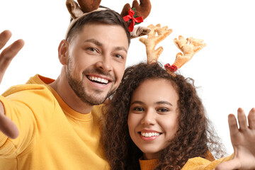 Canvas Print - Happy couple with deer horns on white background