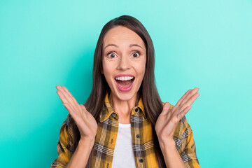 Poster - Photo of astonished mature brunette lady clap arms wear plaid shirt isolated on teal color background