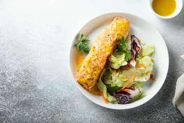 Canvas Print - Baked salmon with orange sauce and salad