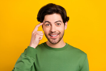 Poster - Photo of smart excited genius positive guy finger temple wear green pullover isolated yellow color background