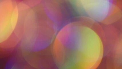 Wall Mural - Rainbow Bokeh Slow Motion. Large multicolor bokeh gradients moving slowly, shimmer, glare and blend and light leaks. Can be used as a background or overlay