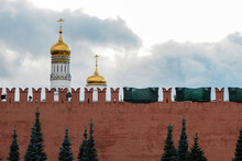 The Broken Cogs Of The Kremlin Wall Against The Background Of The Ivan The Great Bell Tower