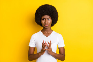 Sticker - Photo of unhappy young afro american woman evil plan hold hands isolated on shine yellow color background