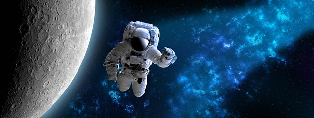 Wall Mural - astronaut in outer,open space , which is behind. blue beautiful nebula.elements of this image furnis