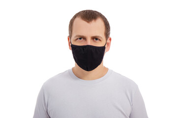 Wall Mural - handsome man in white t-shirt wearing black medical face mask isolated on white background