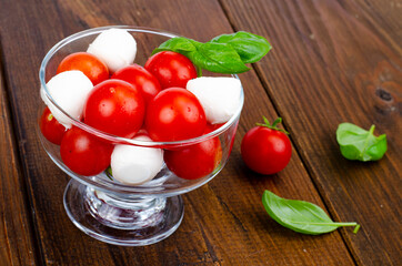 Wall Mural - Caprese salad in glass. Studio Photo.