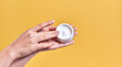 © Olena Apetroaiei - Skin care product. Close-up of women's hands holding a face cream jar. Beauty and spa product.