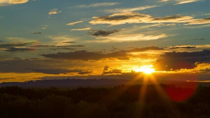 Wall Mural - Panning Time Lapse Beautiful Shot Of Trees In Forest During Dramatic Clouds In Sky At Sunset - Desert, Utah