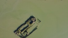 Drone Aerial Top Down Fly Over Shot Of An Overgrown Shipwreck In The Waters Of The Blackwater Estuary Near Maldon Village In Essex, England