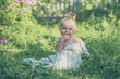 © Anastasia - little child sitting on the grass