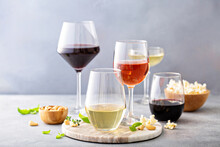 Red, White Wine And Rose In Different Glasses