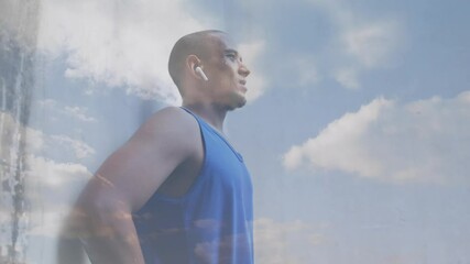 Poster - Animation of clouds over male athlete using wireless earphones and smartwatch exercising outdoors