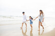 © nikomsolftwaer - Happy family having fun running on beach. Relaxing holiday concept. Travel attention