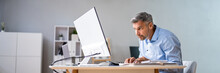 Man Sitting In Bad Posture Working On Computer