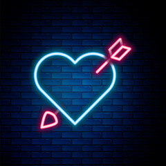 Poster - Glowing neon line Amour symbol with heart and arrow icon isolated on brick wall background. Love sign. Valentines symbol. Colorful outline concept. Vector