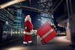 © alphaspirit - Santa claus delivers a big gift for Christmas