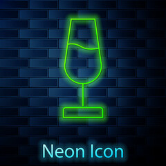 Sticker - Glowing neon line Wine glass icon isolated on brick wall background. Wineglass sign. Vector