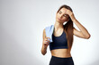© SHOTPRIME STUDIO - athletic woman with dumbbells in hand with workout exercises light background