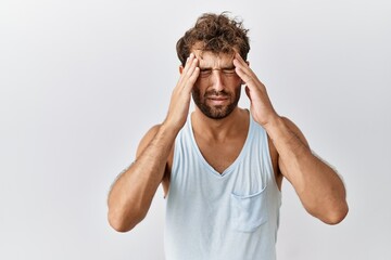 Sticker - Young handsome man standing over isolated background with hand on head for pain in head because stress. suffering migraine.