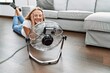 © Krakenimages.com - Young blonde woman smiling confident using fan at home