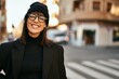 © Krakenimages.com - Young hispanic woman smiling happy standing at the city.