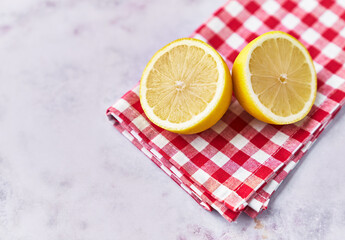  Two lemon halves fruit on a marble surface