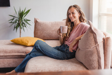 Poster - Calm and peaceful middle-aged woman takes a cup