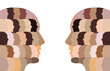 Two multicultural head silhouettes looking at each other. A representation of diversity and equality made of multicultural, ethnic faces with unique black and white race, cultural, skin tones