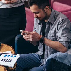 Close up of a man using mobile smart phone