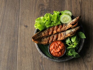 Lele Goreng or Fried Catfish is Traditional Indonesian Culinary Food. Catfish and Chilli Tomato Paste, Popular Street Food Called Pecel Lele Lamongan or Penyetan Lele