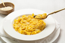 Eating Tortellini Italian Pasta Stuffed With A Mix Of Meat, Parmigiano Cheese And Served In Capon Broth. Close-up.