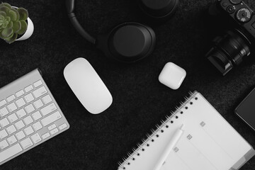 Poster - top view of office desk table with  calculator, notebook, plastic plant, smartphone and keyboard.