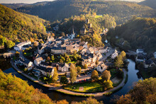 Aerial View Of Esch-sur-Sure, Medieval Town In Luxembourg, Dominated By Castle, Canton Wiltz In Diekirch. Forests Of Upper-Sure Nature Park, Meander Of Winding River Sauer, Near Upper Sauer Lake.