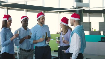 Wall Mural - Office business coworkers celebrating winter holidays together at work and drinking champagne in office. Merry Christmas and Happy New Year.