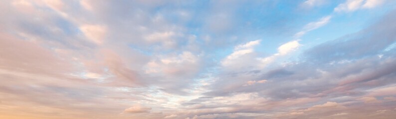 Wall Mural - Clear blue sky with glowing pink and golden clouds after the storm. Dramatic sunset cloudscape. Concept art, meteorology, heaven, hope, peace. Graphic resources, picturesque panoramic scenery