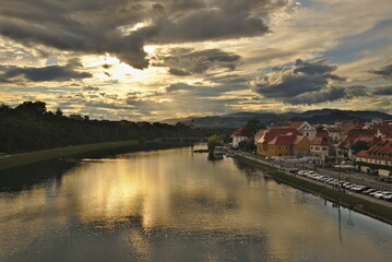 Wall Mural - Maribor, Slovenia. Cityscape image of Maribor, Slovenia at beautiful summer sunset with reflection of the city in Drava River.