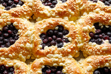 Wall Mural - Traditional sweet yeast buns with the addition of blueberries and butter crumble, close up. Tasty homemade dessert