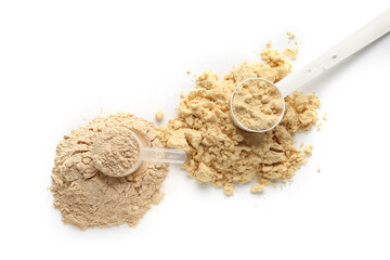 Measuring scoops with protein powder on white background