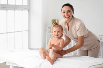 Sticker - Massage therapist working with baby in medical center