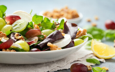 Wall Mural - Italian salad with goat cheese, grapes and walnuts. Healthy Food