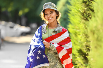 Wall Mural - African-American female soldier with USA flag outdoors