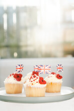 Cupcake With British Union Jack Flag And Poppy Flower. Remembrance Day. Vertical Card. Selective Focus, Copy Space.