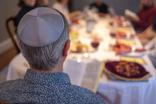 Jewish Man Leading The Passover Seder Wearing A Yarmulkeh