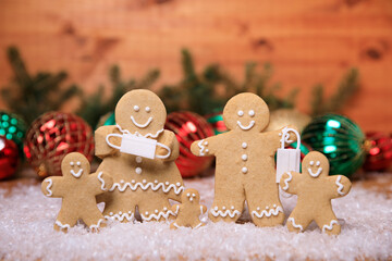 Wall Mural - Masked Ginger Bread Family on a Christmas Festive Background