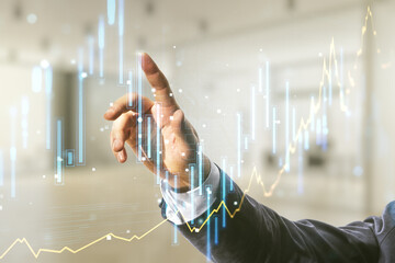 Poster - Multi exposure of businessman hand presses on virtual creative financial chart hologram on blurred office background, research and analytics concept