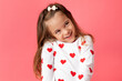© Lisa Tichané - Little girl on pink background making cute shy smile