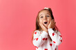 © Lisa Tichané - Cute young girl on pink background making surprised face